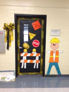 a door decorated to look like construction workers