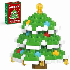 a christmas tree made out of legos is shown next to the box and package