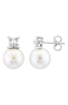 A cluster of 4 bright white diamonds punctuate the top of a pair of fine pearls to create an elegant stud earring style. Post back Total diamond weight: 0.24 ctw 14K white gold, diamonds, cultured pearl Made in USA Formal Diamond Pearl Earrings With Brilliant Cut, Formal Brilliant Cut Diamond Pearl Earrings, Timeless Diamond White Pearl Earrings, Formal Akoya Pearl Diamond Earrings With Diamond Accents, Formal Akoya Pearl Diamond Earrings With Accents, Formal Pear Shaped Diamond Pearl Earrings, Formal Akoya Pearl Diamond Earrings, Formal Pear-shaped Diamond Pearl Earrings, Timeless Diamond-accented Pearl Earrings