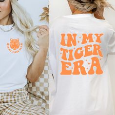 Tiger Era T-shirt. Bella Canvas Unisex T-shirt. Please note: design will not be as bright on dark fabrics. Color may vary slightly due to monitor settings. Made with 100% cotton.  Fabric blends: Ash - 99% Airlume combed and ring-spun cotton, 1% polyester; Heather colors - 52% cotton, 48% polyester; Athletic Heather 90% cotton, 10% polyester. Fit: All shirts are unisex fit, true to size, loose fit. Recommend going up 1-2 sizes for an oversized look. Please check the size chart. If you have any questions, please contact us. Please check your address to make sure it is your current address. Care Instructions:  For the best and lasting results, wash in cold water inside out. No bleach. Dry on low heat or hang dry. Do not iron over design.  Returns: Because this item is made to order, all sales Cheap Crew Neck Top With School Spirit, Affordable School Spirit T-shirt With Screen Print, Vintage School Shirt Designs, Tiger Mascot Shirt Ideas, School Spirit Slogan Top With Relaxed Fit, School Spirit Slogan Top In Relaxed Fit, Relaxed Fit Tops With School Spirit Slogan, Spiritwear Designs School Spirit Wear, White Cotton Tops With Heat Transfer Vinyl