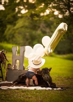 a small child is playing with a cow