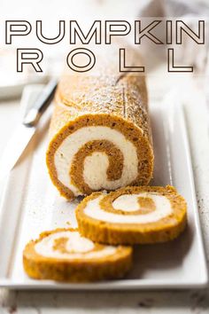 pumpkin roll on a white plate with the words pumpkin roll cut in half and sitting next to it