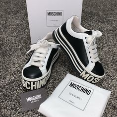 Euc Designer Sneakers By Moschino In Euro Size 37. These Will Best Fit. 6.5-7. I Am A Size 7 And Find Them Slightly Narrow In The Toe Box. They Are Black And White Genuine Leather. Please Zoom In On Pics To See Minor Creasing. They Are In Awesome Condition. I Bought Them Directly From Saks And Have Only Worn Them A Handful Of Times. I’ve Literally Been Stopped In Public By People Wanting To See Them They Come With Original Box, Care Card, And Dust Bag. Moschino Shoes, Moschino Couture, Care Card, Designer Sneakers, Platform Sneakers, Womens Shoes Sneakers, Moschino, Original Box, Dust Bag