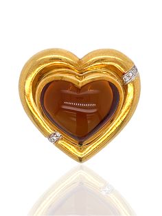 This Tiffany & Co Paloma Picasso vintage brooch is citrine, diamond and 18K yellow gold Jewelry Type : BroochEstate Piece : YesMetal Type : 18K Yellow GoldMetal Weight : 27.47 gramsBrand : TIFFANY & CO PALOMA PICASSOCenter Stone : Stone Type : CitrineCenter Stone : Shape : HeartCenter Stone : Stone Weight : 22.31Center Stone : Quantity : 1.00Center Stone : Size ( MM ) : 15.73Stone Type : DiamondStone Weight : 0.10Color : G-HClarity : VS Gold Diamond Brooch With Gemstone, Yellow Gold Fine Jewelry Brooches For Anniversary, Yellow Gold Diamond Gemstone Brooches, Fine Jewelry Yellow Gold Anniversary Brooches, Gold Brooches For Valentine's Day, Gold Brooches For Formal Valentine's Day, Gold Brooches For Valentine's Day Formal, Gold Heart Brooch For Formal Wear, Gold Heart Brooch For Formal Occasions