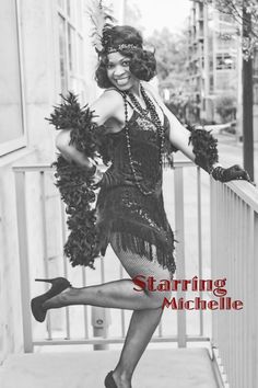 a woman is posing on a balcony with her legs spread out and holding some pom poms