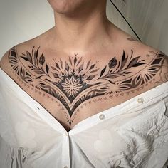 a woman with a tattoo on her chest