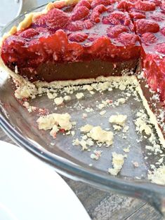 a chocolate and strawberry pie with one slice missing