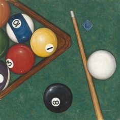 billiard balls and cues on a pool table