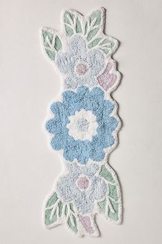 a blue and white flowered design on a piece of paper