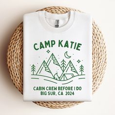 a white t - shirt that says camp kate on it