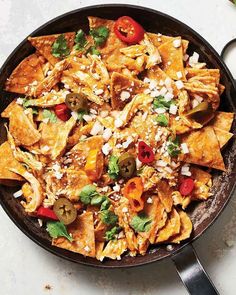 Chicken bouillon powder is the secret to this umami-rich riff on chilaquiles, the classic Mexican dish of salsa-simmered tortillas.