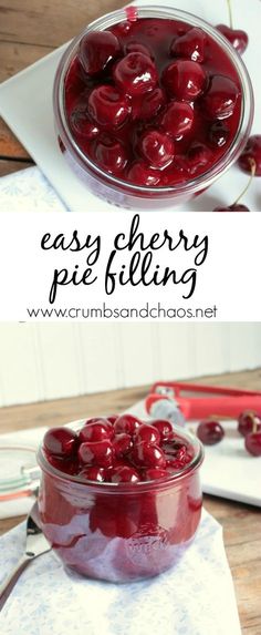 a glass bowl filled with cherries on top of a wooden table