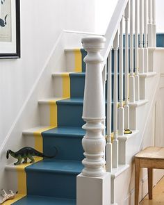 blue and yellow painted stairs in a home