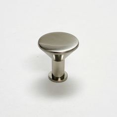 a metal knob on a white background