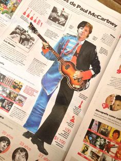 an open magazine with a man holding a guitar