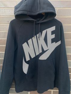 Vintage 1990s Nike Swoosh Graphic Hoodie / 90s Hoodie / Vintage Sweater / Athletic Pull Over / Vintage Nike Mid Swoosh Hoodie - Size L (Length 27" Chest 20") - Overall great vintage condition - Great black fade on it - Perfect for fall - Message me for precise measurements/more information Please take note of the measurements listed as these are vintage clothes and may fit different than the tag size. Follow our page for more vintage clothing drops! Connect with us on Instagram: @recurarchives Nike Pull Vintage, Nike Pull, Nike Mid, 90s Hoodie, Pull Vintage, Black Fade, 90s Nike, Vintage Pullover, Nike Sweater