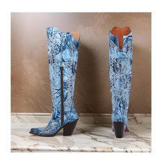 Dan Post Women's Moxie Tall (Snip Toe) Western Boots Medium Sizes in a stunning blue hue. These boots are a true standout piece, featuring a unique textured design with western stitching that adds a touch of style and sophistication to any outfit. Crafted from high-quality leather, these boots boast a leather upper with leather lining for durability and comfort. The 20" shaft height and 2 1/4" western heel create a striking silhouette that is perfect for any Western enthusiast looking to make a Blue Snip Toe Boots With Reinforced Heel, Blue Fitted Snip Toe Boots, Fitted Blue Snip Toe Boots, Western Style Blue Boots With Reinforced Heel, Blue Snip Toe Boots For Fall, Blue Boots With Snip Toe For Fall, Blue Fall Boots With Snip Toe, Fitted Blue Closed Toe Boots, Blue Boots With Leather Sole And Pointed Toe