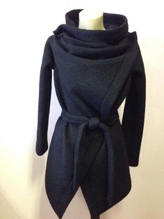 This is a new wool wrap cardigan.Looking fabulous either with the belt,wish is from the same material or without it.It will best fit for size S/M The colour is black .It is 100%wool and is really warm,would recommend dry cleaning for washing it.It does not have lining,it is like a big cosy shawl with sleeves.Has two discret buttons.An outstanding piese of clothing for the upcoming season.SIZE CHARTSIZE S - US 6, UK 8, EU 36bust: bust around 34.5”/90cmWaist: waist around 27.5”/70cmHips: hips arou Belted Long Sleeve Sweater Coat For Fall, Belted Long Sleeve Sweater Coat, Fitted Wrap Outerwear For Winter, Fitted Wrap Winter Outerwear, Fall Long Sleeve Faux Wrap Cardigan, Fall Faux Wrap Long Sleeve Cardigan, Belted Wrap Outerwear For Fall, Wool Wrap Outerwear For Fall, Fall Wrap-style Belted Outerwear