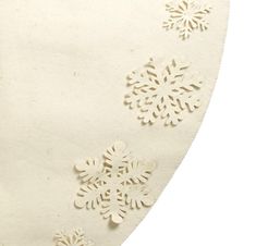 a white piece of cloth with snowflakes on the front and back of it