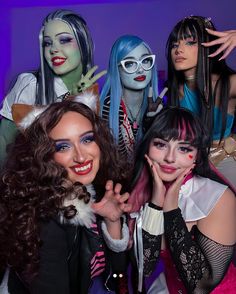 several women dressed in costumes posing for a photo