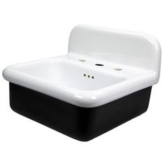 a black and white sink with two faucets on the front, and an open drain