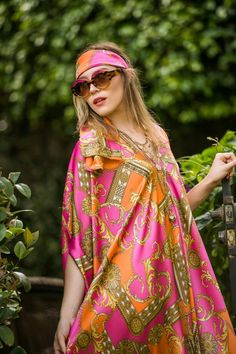 This colorful caftan is the answer to glam layering. Made with a yards of ultralight satin rayon and lots of love. Bohemian splendor, handmade in California. Our caftans are a voluminous one-size fits all garment, approximately 50" in length. The intention of this shape is to celebrate the magic of fabric and its captivating dance with form. JG one-size caftans are collected from petite to plus sized collectors, and everything in between. Machine wash cold, gentle cycle, and hang dry for optimal Multicolor Silk Tunic, Pink Silk Kaftan For Vacation, Pink Silk Bohemian Kaftan, Vibrant Silk Kaftan, Elegant Multicolor Tunic For Summer, Elegant Multicolor Summer Tunic, Pink Vibrant Print Kaftan For Vacation, Pink Vibrant Print Kaftan For Summer, Bohemian Silk Kaftan With Vibrant Print