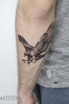 an eagle tattoo on the arm