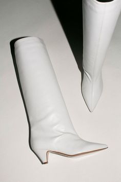 A knee high boot for everyday with an easy 2.5", cone shaped heel. 100% leather upper, made in Italy. Available in mango suede, white leather, and rosa suede. 60s White Boots, White Boots, White Flats, Custom Items, Knee High Boots, White Leather, Knee High, Leather Upper, Shoe Boots