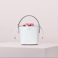 Kate Spade Pippa Small White Bucket Bag, Nwt. A Classic Silhouette, Miniaturized. One Of Our Most-Loved Styles, The Pippa Small Bucket Bag Is Now Crafted From Floral Denim. A Faille Lining W/ A Drawstring Closure Keeps Your Essentials Secure & Can Be Tucked In & Hidden. A Removable, Adjustable Strap Transforms This Little Carry-All Into A Cute Crossbody. Bucket Bag W/ Drawstring Closure Optional/Adjustable Shoulder Strap Floral Denim Faille Lining Enamel Spade 6"H X 5.5"W X 4.7"D Strap Drop 22" Designer White Bucket Bag With Top Carry Handle, Luxury White Bucket Bag With Top Handle, Luxury White Bucket Bag With Top Carry Handle, Luxury White Bucket Shape Shoulder Bag, White Bucket Bag With Top Carry Handle, Luxury White Bucket-shaped Bag, Luxury White Bucket Bag, Luxury White Pouch Bucket Bag, Luxury White Pouch-style Bucket Bag