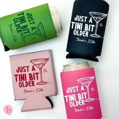 four different types of can coolers on a white surface with the words just a tin bit older printed on them