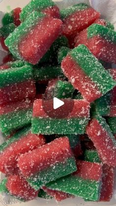 a bowl filled with candy covered in green and red sugar