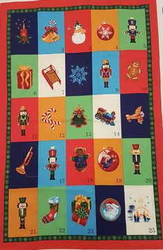 a christmas quilt with many different items on it and numbers in the center, including santa's helpers