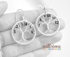 "These family tree earrings are wire-sculpted with silver filled wire. Each piece is handcrafted by me and none of the trees will be exactly the same. You could include yourself, your parents, your grandparents or your kids. Each piece is going to be completely custom made for you! Each tree fits up to 6 birthstone color crystals max and only on the branches, so you can have a total of 12 crystals on a pair. Each crystal represents birthstone colors. You can choose to have both earrings match, o Nature-inspired Wire Wrapped Earrings As Gift, Tree Of Life Jewelry For Mother's Day Gift, Nature-inspired Wire Wrapped Earrings For Gifts, Nature-inspired Silver Wire Wrapped Earrings, Mother's Day Tree Of Life Necklace Gift For Mom, Silver Wire Wrapped Nature-inspired Earrings, Tree Of Life Necklace For Anniversary On Mother's Day, Nature-inspired Wire Wrapped Sterling Silver Earrings, Mother's Day Tree Of Life Necklace