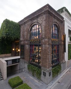 an old brick building with ivy growing on it