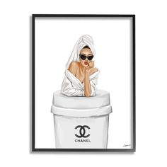 a woman wearing sunglasses sitting on top of a trash can with her hand under her chin