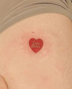 a woman's stomach with a heart shaped sticker that says care returns on it