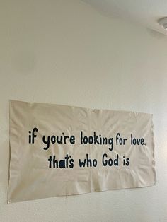 a sign on the wall that says if you're looking for love, that's who god is