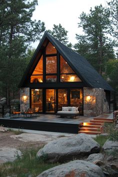 a house that is surrounded by rocks and trees