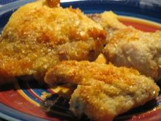 two pieces of fried chicken on a plate