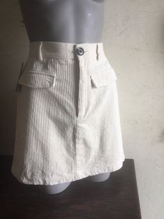 "Off White Corduroy A-line Mini Skirt 2 false pockets  Button & zip closure  5 belt loops Waist 28\" Hip 34\" Length 16.5\" Best fit Australian size 10 Good condition" High Waist Corduroy Skirt With Pockets, Corduroy Skirt With Pockets For Work, Corduroy Mini Skirt For Work, Casual Corduroy Mini Skirt With Pockets, Fitted Corduroy Mini Skirt With Pockets, Spring Corduroy Skirt With Pockets, Fitted High Waist Corduroy Skirt, High Waist Fitted Corduroy Skirt, High Waist Fitted Corduroy Mini Skirt