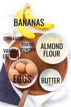 bananas, cinnamon, baking powder, almond flour, and eggs on a wooden plate