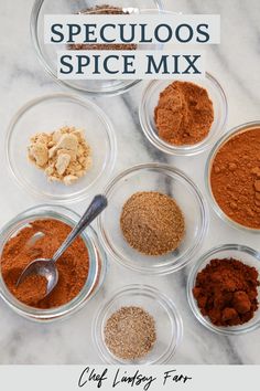 six bowls filled with spices on top of a marble counter