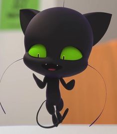 a black cat with glowing green eyes is standing in front of a computer screen