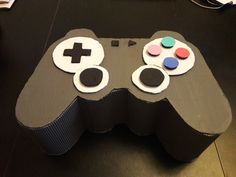 a video game controller made out of cardboard