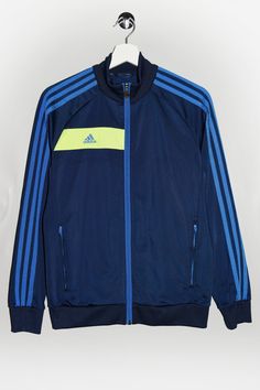 "Adidas Nitrocharge track jacket in navy blue and neon yellow. - Size tag: Please always check measurements before buying. Tag is torn away, Fits like Women's S/M - Measurements (laying flat): Pit to Pit: 19\" Length: 25\" Pit to Cuff: 20.5\" -Wear: /Please see images for details/ Good used condition. -Flaws: / serious wear, tears, holes, marks or stains/  None - Fabric: Polyester *All of our items are preloved pieces so some signs of natural wear and age are to be expected. Please look through the photos carefully to check if the condition is to your satisfaction. *All efforts are made to show any defects however small imperfections may be missed. In cases that we've missed a major flaw, please remember that we are still human and make mistakes, please contact us first so we can work out Navy Adidas Track Jacket For Sports, Adidas Navy Long Sleeve Track Jacket, Blue Functional Adidas Outerwear, Blue Adidas Long Sleeve Track Jacket, Adidas Track Jacket With Double-lined Hood For Sports, Jacket Outfit Women, Adidas Hoodie, Neon Yellow, Track Jackets