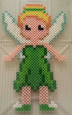 an image of a beaded figure made out of legos and plastic pegs