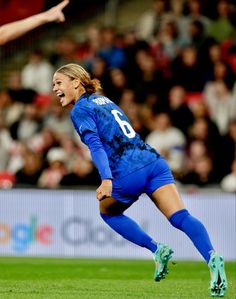 a female soccer player in action on the field