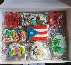 decorated cookies in a box with flags and other decorations on them, including an american flag