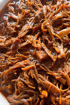 shredded beef and carrots in a white bowl