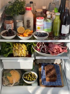 an open refrigerator filled with lots of food